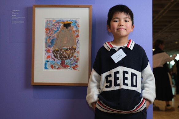 Logan Zhang, 6,  with his winning portrait, ‘My Dad’.