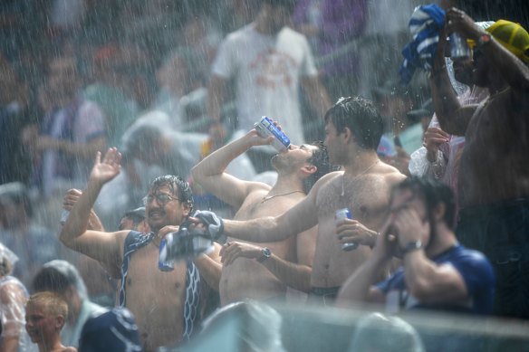 Fans aren’t letting the weather ruin their day. 