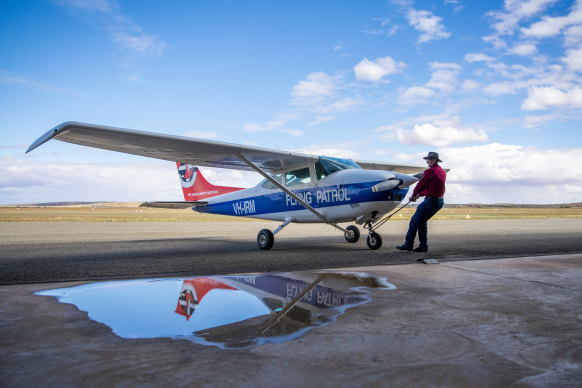 Flying Padre David Shrimpton with his plane at Broken Hill Airport.