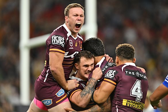 Delighted Brisbane players celebrate a try in their rout of the Bulldogs on Thursday night.