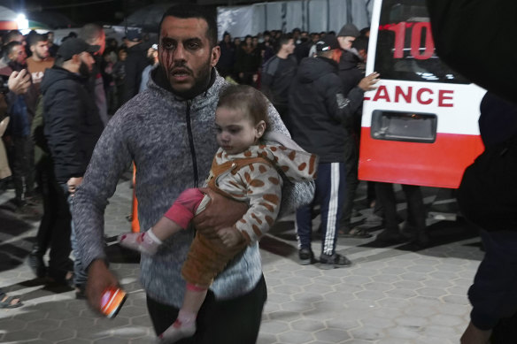 Palestinians wounded in the Israeli bombardment of the Gaza Strip arrive at the hospital in Deir al-Balah.