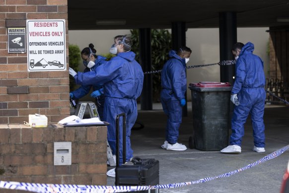 Police at a unit block on Newman Street in Merrylands where a woman’s body was found.