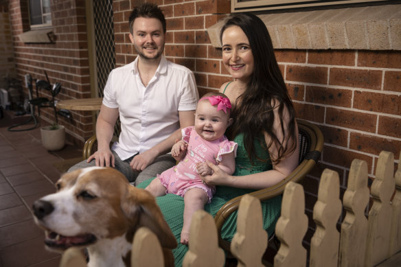 Cameron Trevor with wife Lauren, daughter Aribella and Luna the beagle at their home in North Parramatta.