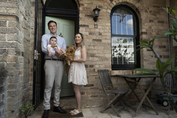 Josh Dorey, son Huxley and wife Amanda Koo with their dog Rosie at their Edgecliff home.