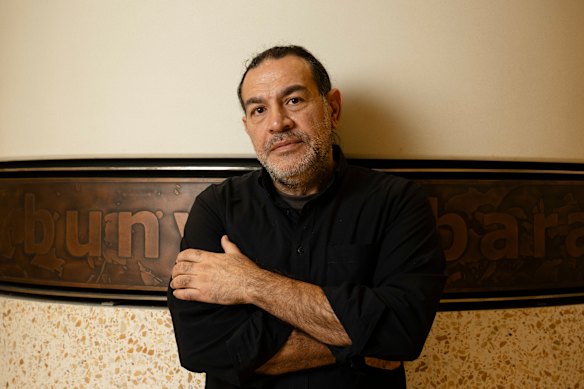 Artist Khaled Sabsabi, who had his invitation to participate in the Venice Biennale revoked by Creative Australia, with his work at Barangaroo Metro Station in Sydney.