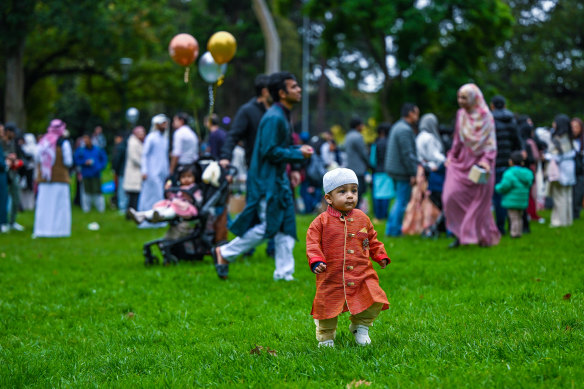 A child enjoys the festivities after Eid prayers at Flagstaff Gardens. 