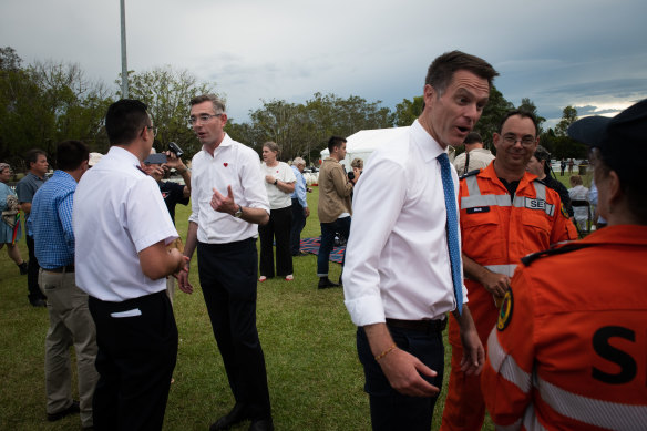 NSW Premier Dominic Perrottet and Opposition Leader Chris Minns attend a memorial in Lismore in February to mark a year since the floods.
