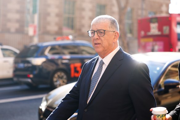 Former Liverpool City Council chief executive John Ajaka, a former president of the NSW Legislative Council, arrives at the inquiry on Wednesday.
