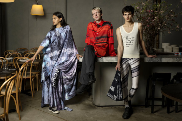 Designer Alix Higgins (centre) with models Emily Stenberg and Tomas Genero at The Apollo restaurant in Potts Point, Sydney. Higgins has won the emerging designer award at the Australian Fashion Laureate.