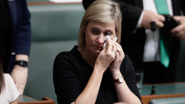 Labor MP Susan Lamb wipes away tears after delivering a statement on her citizenship in Parliament on Wednesday.
