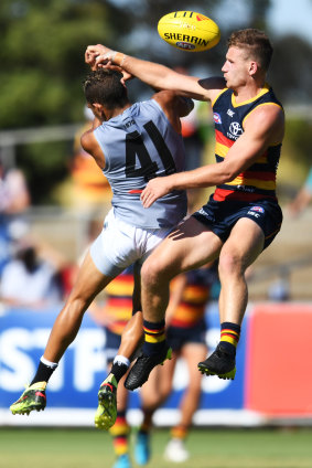 Adelaide's Rory Laird and Dom Barry compete in the air.
