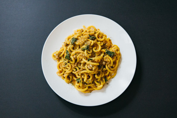 One of the restaurant’s famous dishes: saffron gramigna with pork sausage and fennel ragu. 