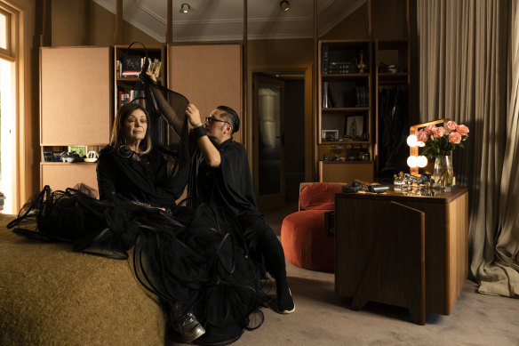 Dr Gene Sherman with fashion designer Alistair Trung in her bedroom at her home in Centennial Park.