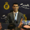 Cristiano Ronaldo smiles during a press conference for his official unveiling as a new member of Al Nassr soccer club in in Riyadh.