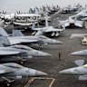 Fighter jets on the flight deck of the USS Abraham Lincoln.