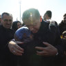 Turkish President Recep Tayyip Erdogan hugs a survivor in Kahramanmaras, a city devastated by last month’s earthquakes.