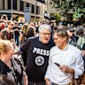 Late Night Live host David Marr (centre left) speaks to Four Corners reporter Angus Grigg during a rally by staff outside the public broadcaster’s headquarters in Sydney.