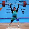 Kyle Bruce performs a clean and jerk during the men’s 81kg final