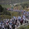 ‘We’re here to stay’: Defiant settlers, hardline ministers march to West Bank outpost