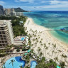 Aereal photo of Waikiki beach with view of Diamond Head mountain in the distance. iStock image for Traveller. Re-use permitted.