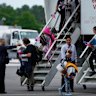 The Afrikaner refugees arrived at Dulles International Airport.