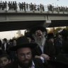 Ultra-Orthodox Jewish men block a highway during a protest against army recruitment in Bnei Brak, Israel.