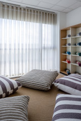 A wellness room – with cushions and yoga mats – designed by Unispace for Pfizer’s Dublin office in mid-2020.