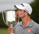 Scott kisses the trophy he hopes is an ideal omen for Augusta.