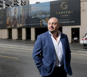 Larry Kestelman in 2016 in front of the hoarding for his Capitol Grand project in South Yarra.