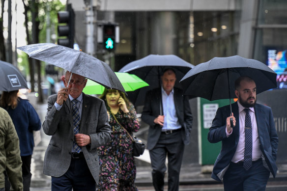 Umbrellas are out in force.