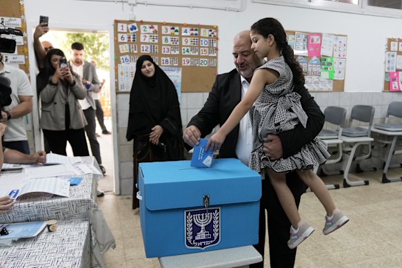 Israeli lawmaker Mansour Abbas, leader of the Ra’am party, casting his ballot alongside his family.
