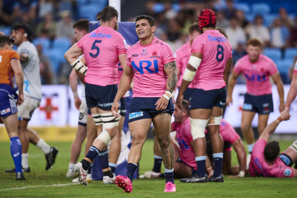 Izaia Perese reacts to a try