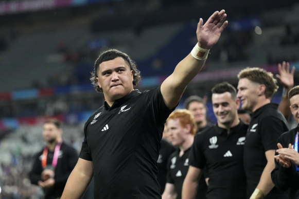 New Zealand’s Tamaiti Williams greets fans after the Rugby World Cup semifinal