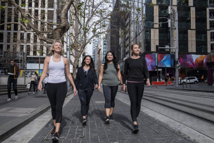 Rachelle Kells, Simone Coburn, Cecilia Palmero and  Victoria Day walking to work in the city to avoid using public transport. 