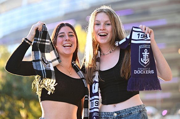 Friendly rivalry: fans of Collingwood and Fremantle show their colours.