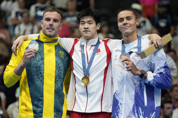 Kyle Chalmers, gold medallist Pan Zhanle of China and bronze medallist David Popovici of Romania following the men’s 100 metres freestyle final.