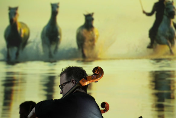 ACO cellist Timo-Veikko ‘Tipi’ Valve with some of the imagery from River.