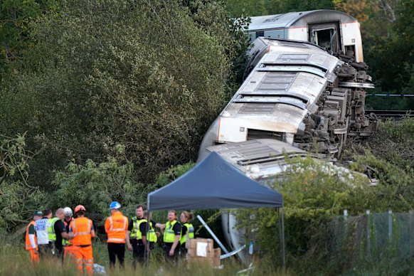 Flipped carriages of the derailed train near the town of Lewes, in southern England, on Thursday.