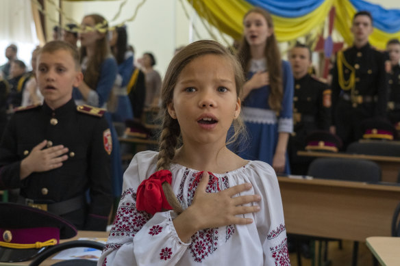 Students of a military school sing the national anthem in Kyiv on Ukraine’s Statehood Day. Cadets launched a crowdfunding campaign to buy the first F-16 Fighting Falcon jet to help the Ukrainian air forces fighting against Russia.