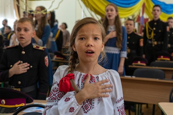 Students of a military school sing the national anthem in Kyiv on Ukraine’s Statehood Day. Cadets launched a crowdfunding campaign to buy the first F-16 Fighting Falcon jet to help the Ukrainian air forces fighting against Russia.