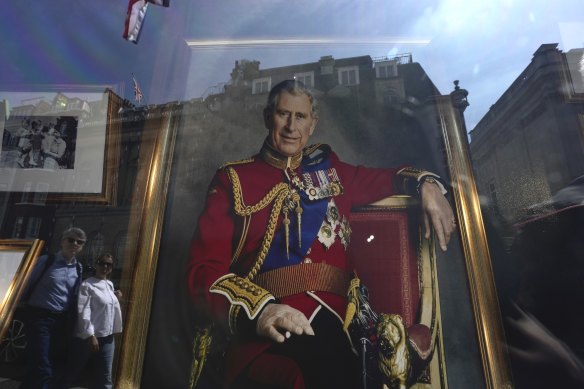 A portrait of Britain’s King Charles III in a London storefront  ahead of his coronation on Saturday.