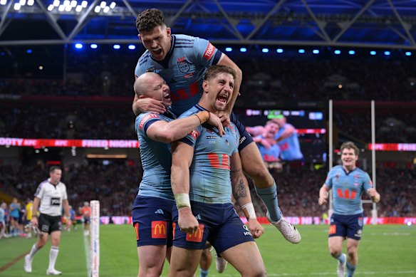 Zac Lomax celebrates one of his two tries.