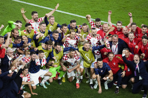 Croatia players celebrate after the team’s qualification to the knockout stage.