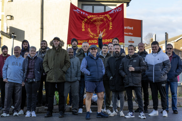 Postal workers stand on a picket line outside Dartford delivery office in Dartford, England. 