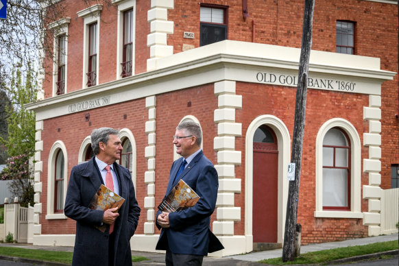 Former premiers John Brumby (left) and Denis Napthine outside the Old Gold Bank in Creswick on Thursday.