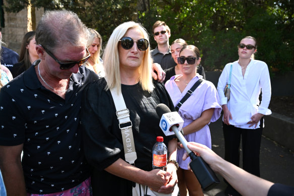 Dale (left) and Marlene Parrott (centre), parents of Maddison Jane Parrott, speak outside the Geelong courthouse on Friday.
