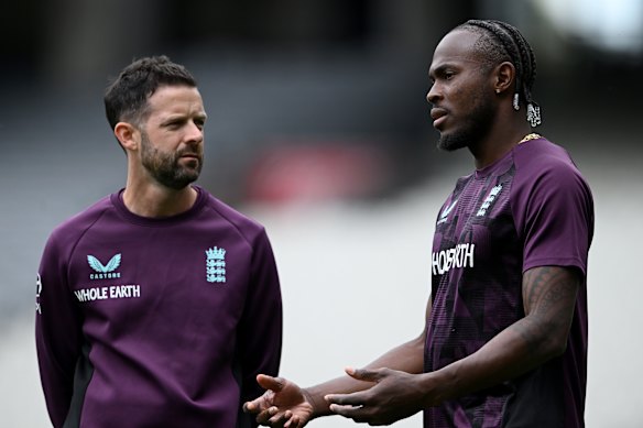 Jofra Archer (right) with England’s physio at training on Wednesday before the paceman was ruled out for the rest of the Ashes series.