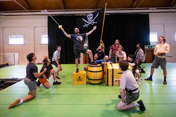 The cast of Victorian Opera’s latest staging of The Pirates of Penzance in rehearsal. 
