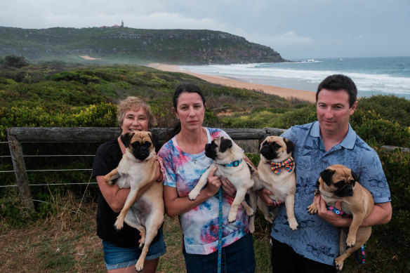 Pittwater Unleashed president Michele Robertson (left) with Natalie and Anthony Castellan and their dogs overlooking the proposed off-leash dog area at Palm Beach.