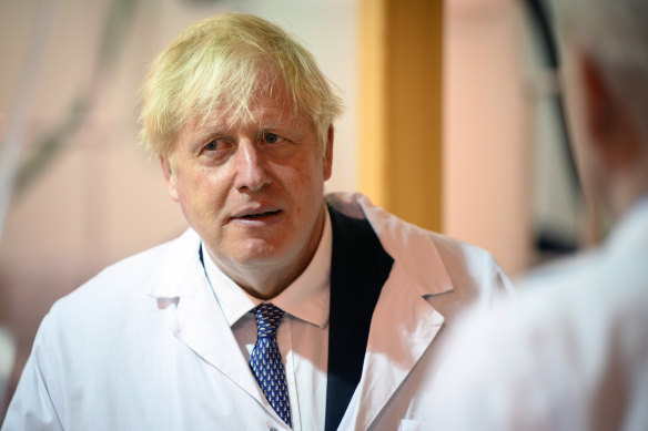Boris Johnson, pictured during a promotional visit for biomedical research funding this week, will remain prime minister until September.